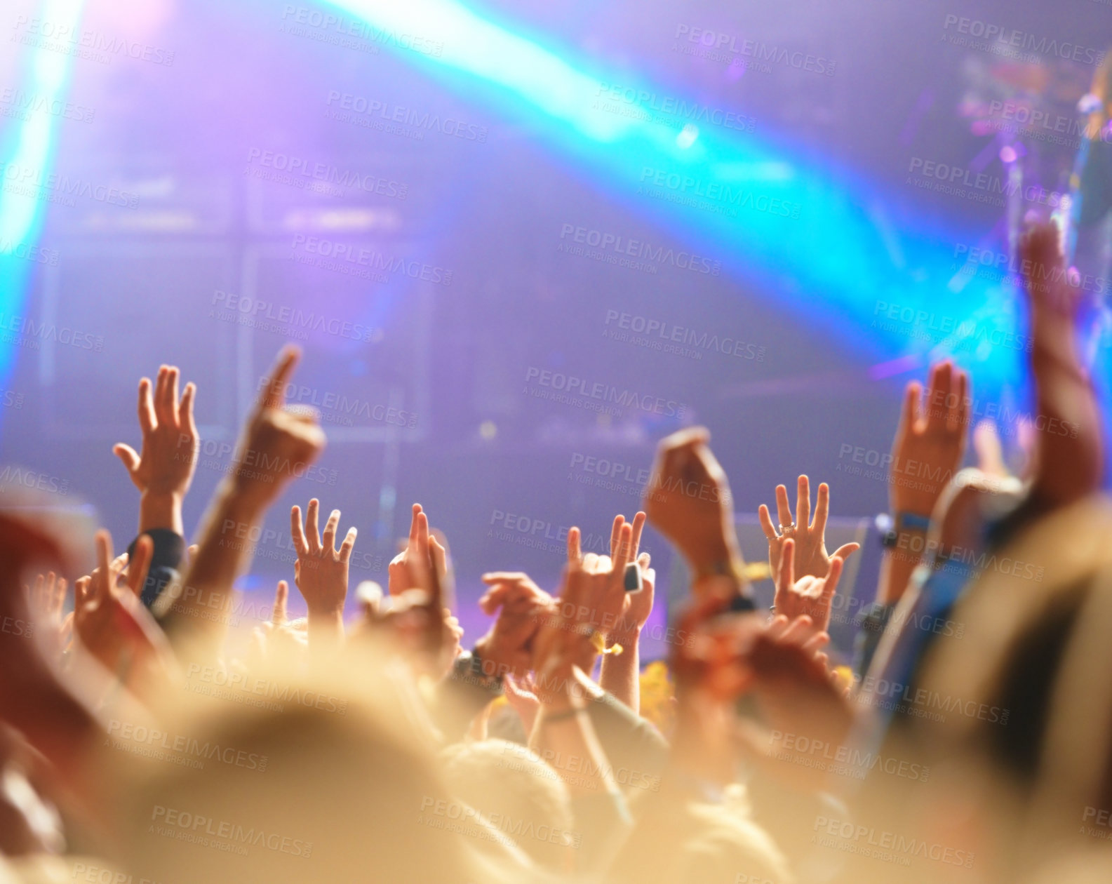 Buy stock photo Concert, audience and hands in crowd with light for music festival, night club and dancing with energy. Disco, party and people with signs, gesture and performance at rock event with entertainment 