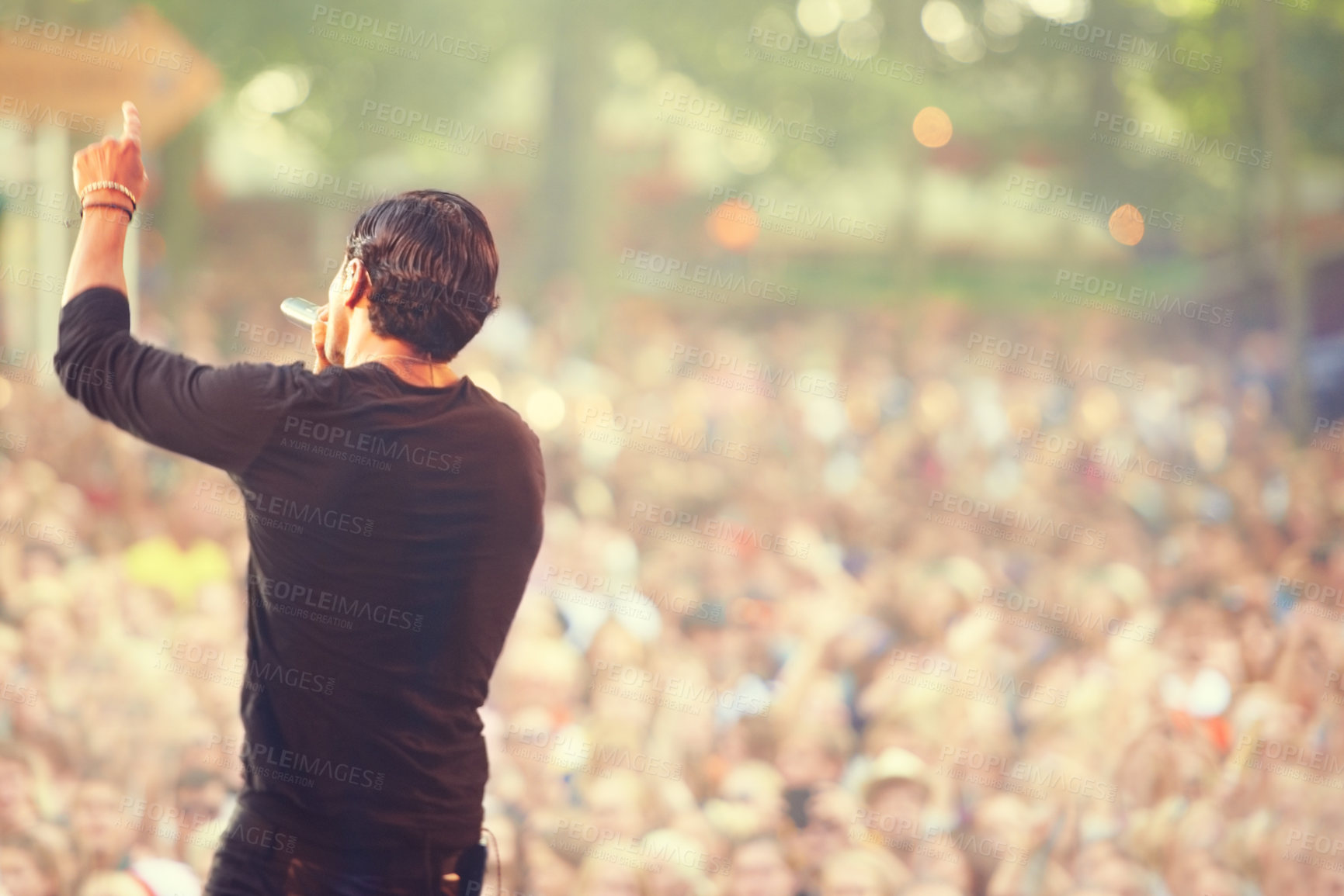 Buy stock photo Music, microphone and singer with man at concert for rock festival, performance and party in nature. Celebration, energy and audience with male musician on stage for club, show and event in outdoors