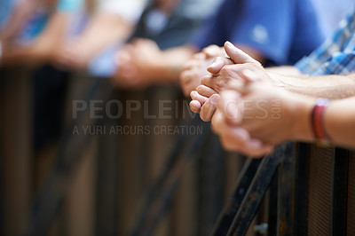 Buy stock photo Hands, row and group of people in festival, outdoor and gate to block audience or fans in event or concert. Closeup, leaning and community waiting together with respect in for live entertainment