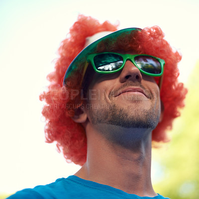 Buy stock photo Man, wig and sunglasses with nature, sky and festival for fun, joy and celebration. Person, summer and concert with low angle, smile and happy for event, party or sunshine for celebration and closeup