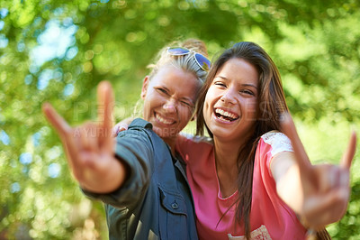 Buy stock photo Two young female friends having fun at an outdoor event