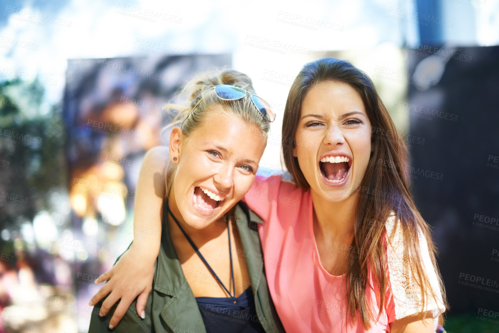 Buy stock photo Two young female friends having fun at an outdoor event