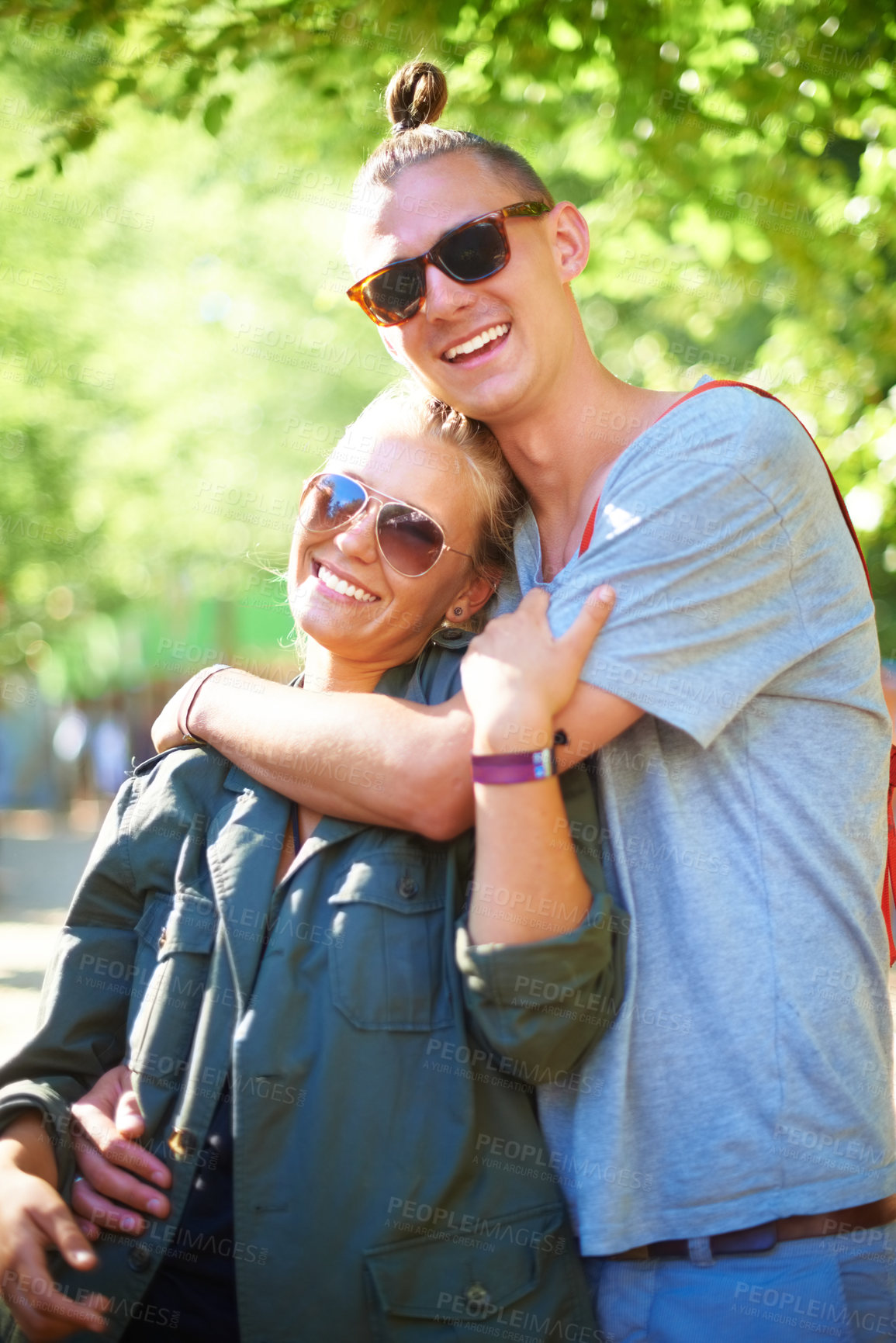 Buy stock photo Portrait, smile and couple hug at music festival, event and celebration on valentines day together in summer. Face, man and happy woman in sunglasses, embrace and party outdoor for love in nature