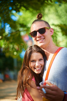 Buy stock photo Two young people smiling happily while standing outside