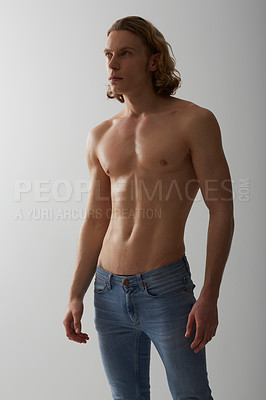 Buy stock photo Studio shot of a young man with a bare chest