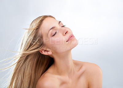 Buy stock photo A beautiful young woman with bare shoulders against a white background