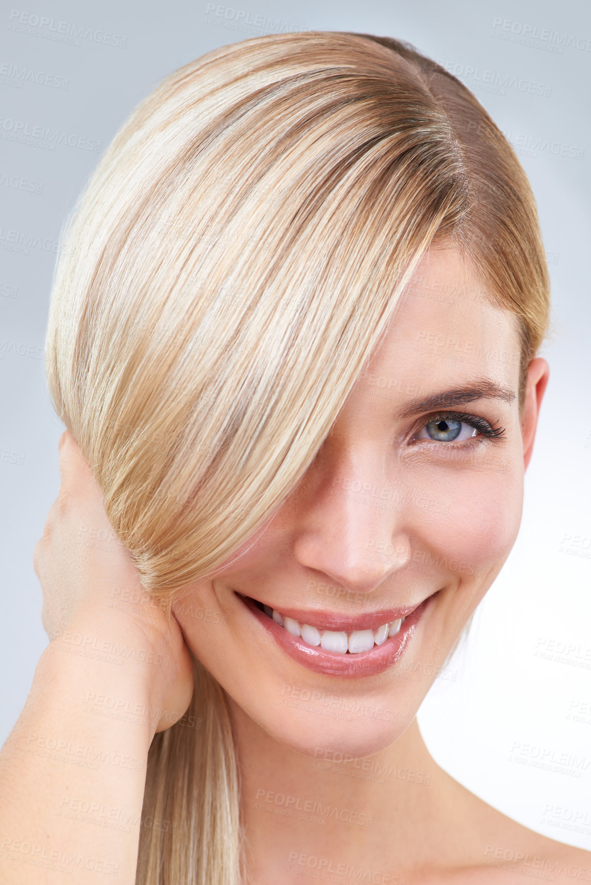 Buy stock photo Studio portrait of a young woman with long blonde hair