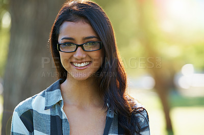 Buy stock photo Woman, portrait and student outdoors on campus, eyewear and pride for education in nature. Female person, confidence and glasses for learning or enjoying park or garden, happy and positive outside