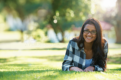 Buy stock photo Portrait, park or happy woman on grass to relax for rest in garden, nature or field with peace. Travel, glasses and female person on break with smile for summer vacation, holiday or wellness on lawn