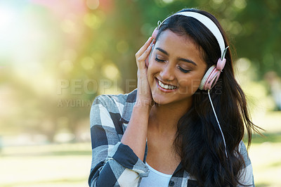 Buy stock photo Music, headphones or happy woman in park to relax in garden, nature or field with smile or peace. Eyes closed, streaming or calm female person on break with playlist for radio, podcast or wellness