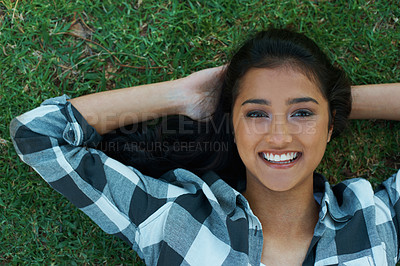 Buy stock photo Nature, grass and woman happy in portrait, smiling and relaxed on vacation in Dubai for peace. Female person, resting and enjoyment for holiday on outdoor lawn, adventure and travel to countryside