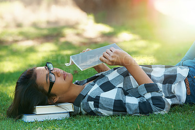 Buy stock photo Relax, grass or woman in park reading book for learning knowledge, information or education. Thinking, textbook or female student in nature for studying history, story or novel on college campus lawn