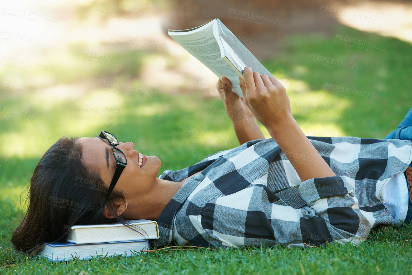 Buy stock photo Relax, grass or happy woman in park reading book for learning knowledge, information or education. Smile, textbook or student in nature for studying history, story or novel on college campus lawn