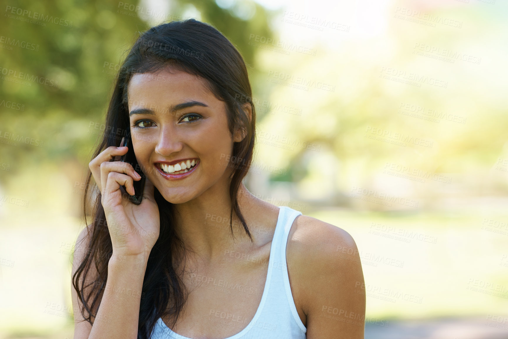 Buy stock photo Portrait, phone call and happy woman in the park for a summer vacation in Canada online. Internet, mobile app conversation and indian female person with a smile on technology while relaxing in garden