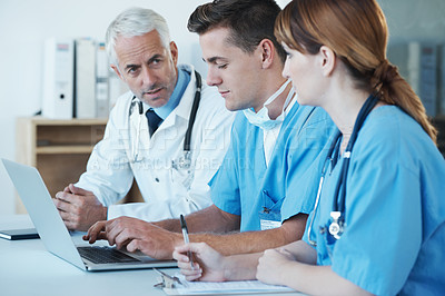 Buy stock photo Laptop, discussion and doctor with nurses in hospital for medical diagnosis or treatment meeting. Team, computer and senior surgeon talking to healthcare workers for surgery research in clinic.