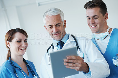 Buy stock photo Tablet, team and doctor with nurses in hospital for medical diagnosis or treatment discussion. Meeting, digital technology and senior surgeon talk to healthcare workers for surgery research in clinic
