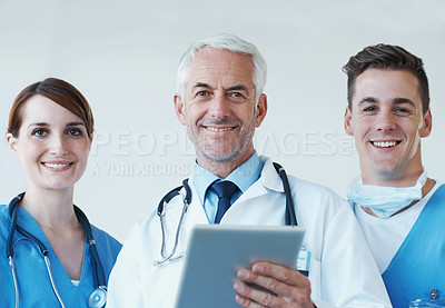 Buy stock photo Tablet, smile and portrait of doctor with nurses in hospital for medical diagnosis or treatment discussion. Team, digital technology and senior surgeon with healthcare workers for surgery in clinic.
