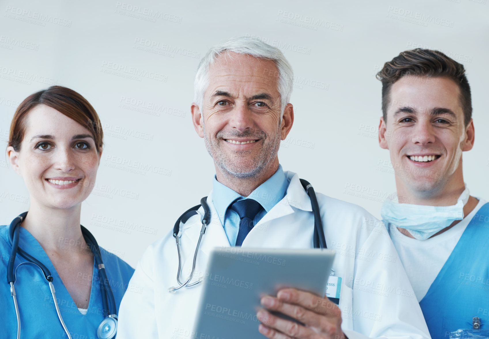 Buy stock photo Tablet, smile and portrait of doctor with nurses in hospital for medical diagnosis or treatment discussion. Team, digital technology and senior surgeon with healthcare workers for surgery in clinic.