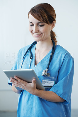 Buy stock photo Research, tablet and woman nurse in hospital for medical diagnosis or treatment information. Professional, nursing and young female healthcare worker with digital technology in medicare clinic.