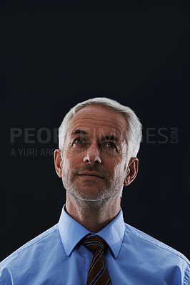 Buy stock photo Thinking, planning and senior business man in studio with startup, vision or future goals on black background. Idea, questions or old entrepreneur looking up at mockup for solution or brainstorming