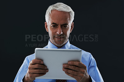 Buy stock photo CEO, tablet and business man research information in studio isolated on a black background. Digital technology, professional or senior consultant on internet, networking or reading email notification