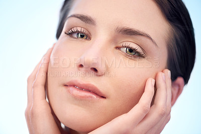 Buy stock photo Beauty, skincare and portrait of woman in studio with health, cosmetic and facial routine. Wellness, glow and closeup of young female person with face dermatology treatment by blue background.