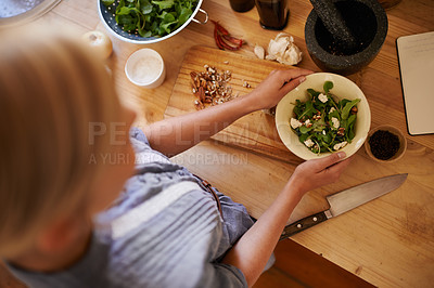 Buy stock photo Cooking, woman and salad in a home with green diet, nutrition and healthy food from above. Kitchen, bowl and leaves for organic and vegan lunch with knife and wood board in a house with wellness