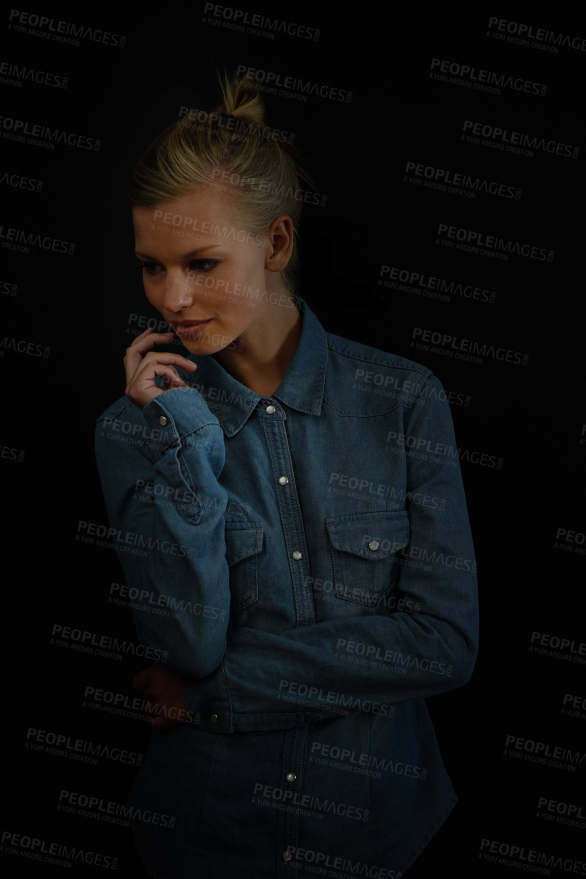 Buy stock photo Dark background, fashion and woman while thinking, looking and down in studio with denim shirt. Female model, vision and planning of ideas for trendy, professional designers and fashionable mockups