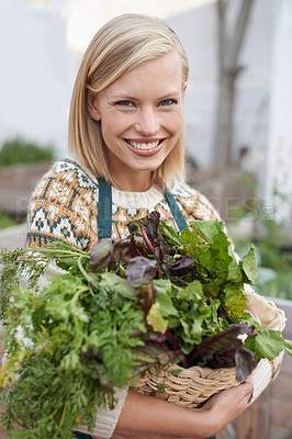 Buy stock photo Portrait of an attractive young woman doing some vegetable gardening