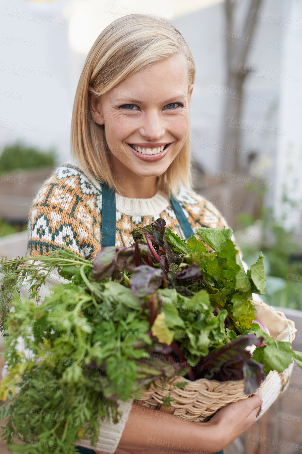 Buy stock photo Portrait of an attractive young woman doing some vegetable gardening