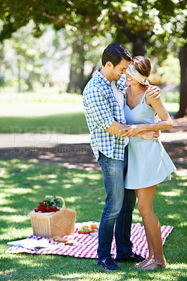 Buy stock photo Love, picnic and surprise with couple in park for romance, bonding and summer vacation. Happiness, commitment and relax with man and woman on date in nature for funny, support and relationship