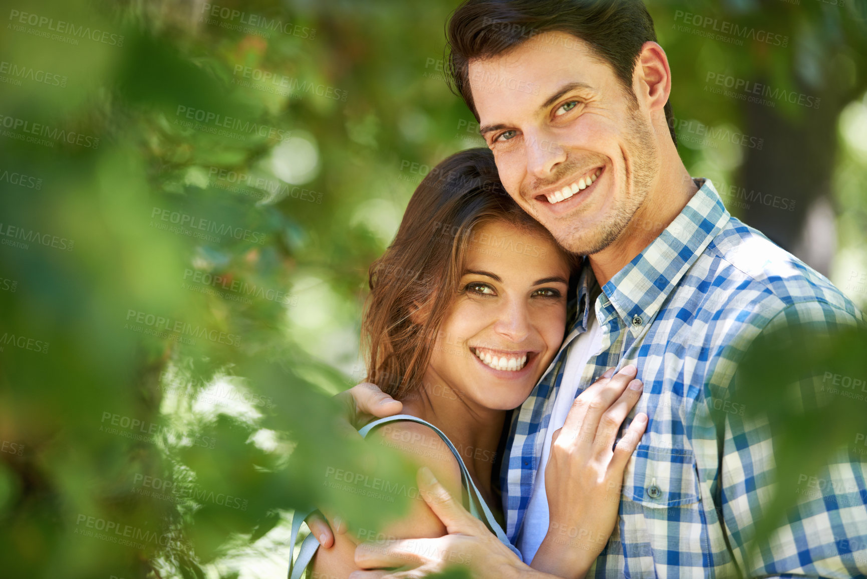Buy stock photo Portrait, happy young couple and hug in nature in the park and bonding outdoors in Italy. Love, relationship and travel with romantic partners, getaway date for holiday summer laughing with affection