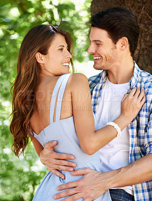 Buy stock photo Love, happy and summer with couple in park for romance, date and care or bonding. Smile, relax and relationship with young man and woman hugging together in nature for vacation, calm and holiday
