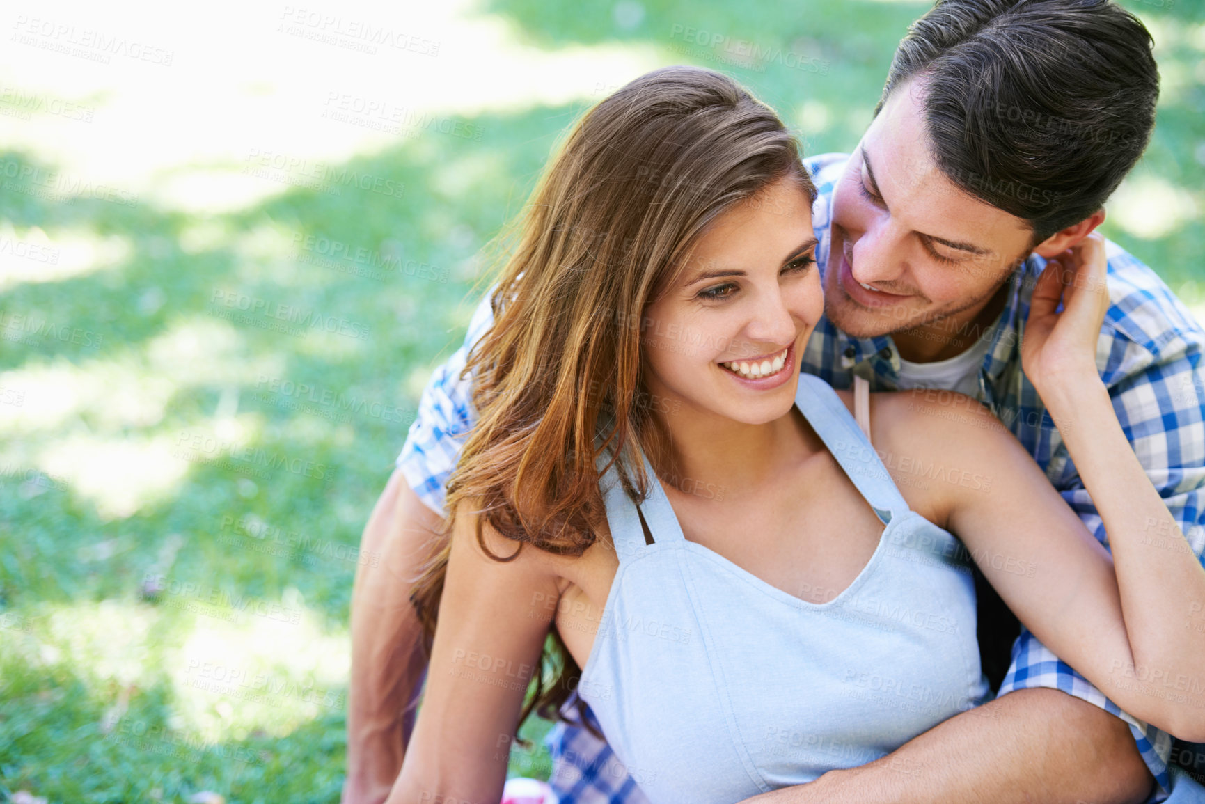 Buy stock photo Man, woman and embrace on grass in park for holiday bonding in summer for relax, partnership or love. Happy couple, hug and ground in backyard garden in nature for vacation date, lawn or sunshine