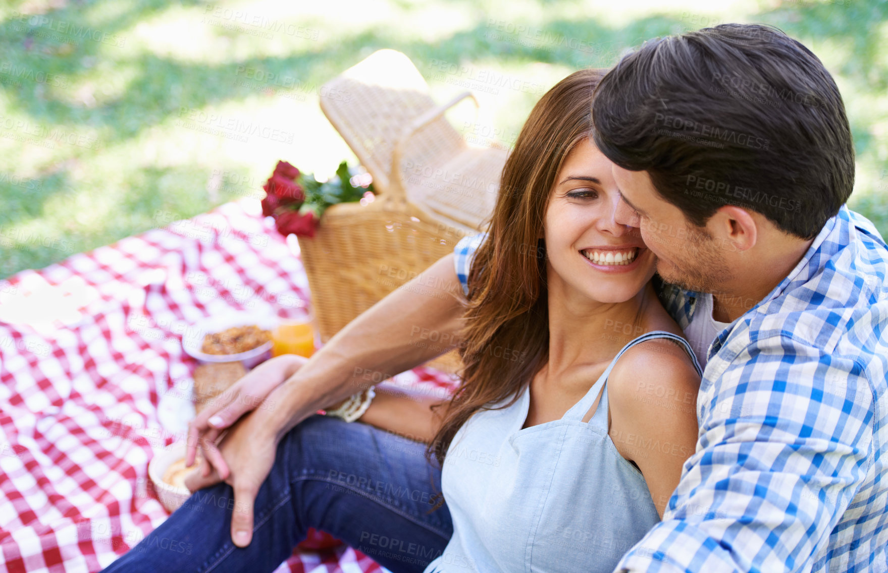 Buy stock photo Love, picnic and roses in basket with couple for Valentine's Day for celebration, anniversary and relax on vacation. Happy, food and travel with romantic partners, park date for holiday summer 