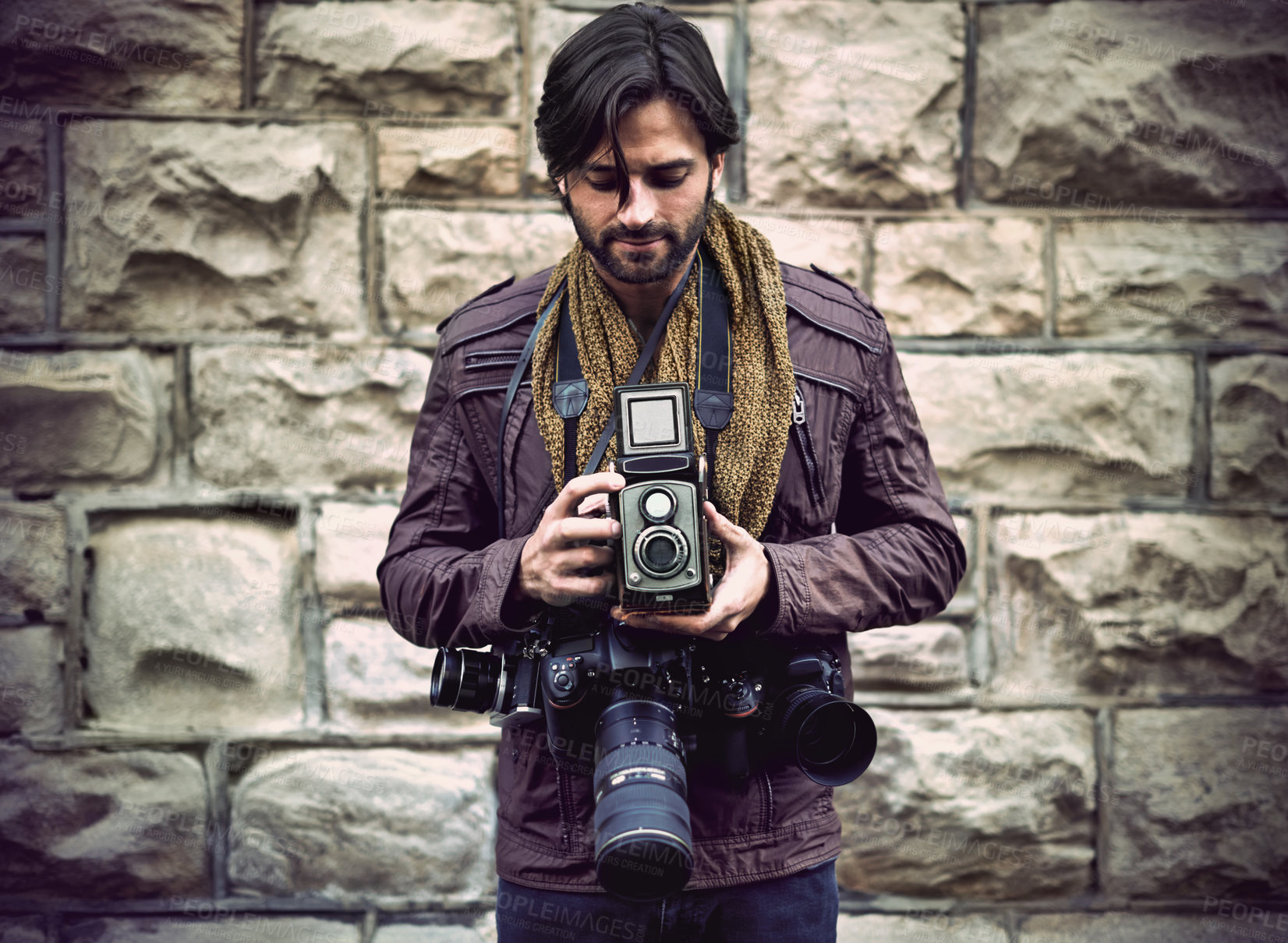 Buy stock photo Shot of a handsome young photographer at work in the city