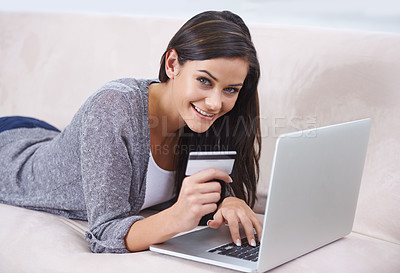 Buy stock photo Shot of a young woman doing some online shopping