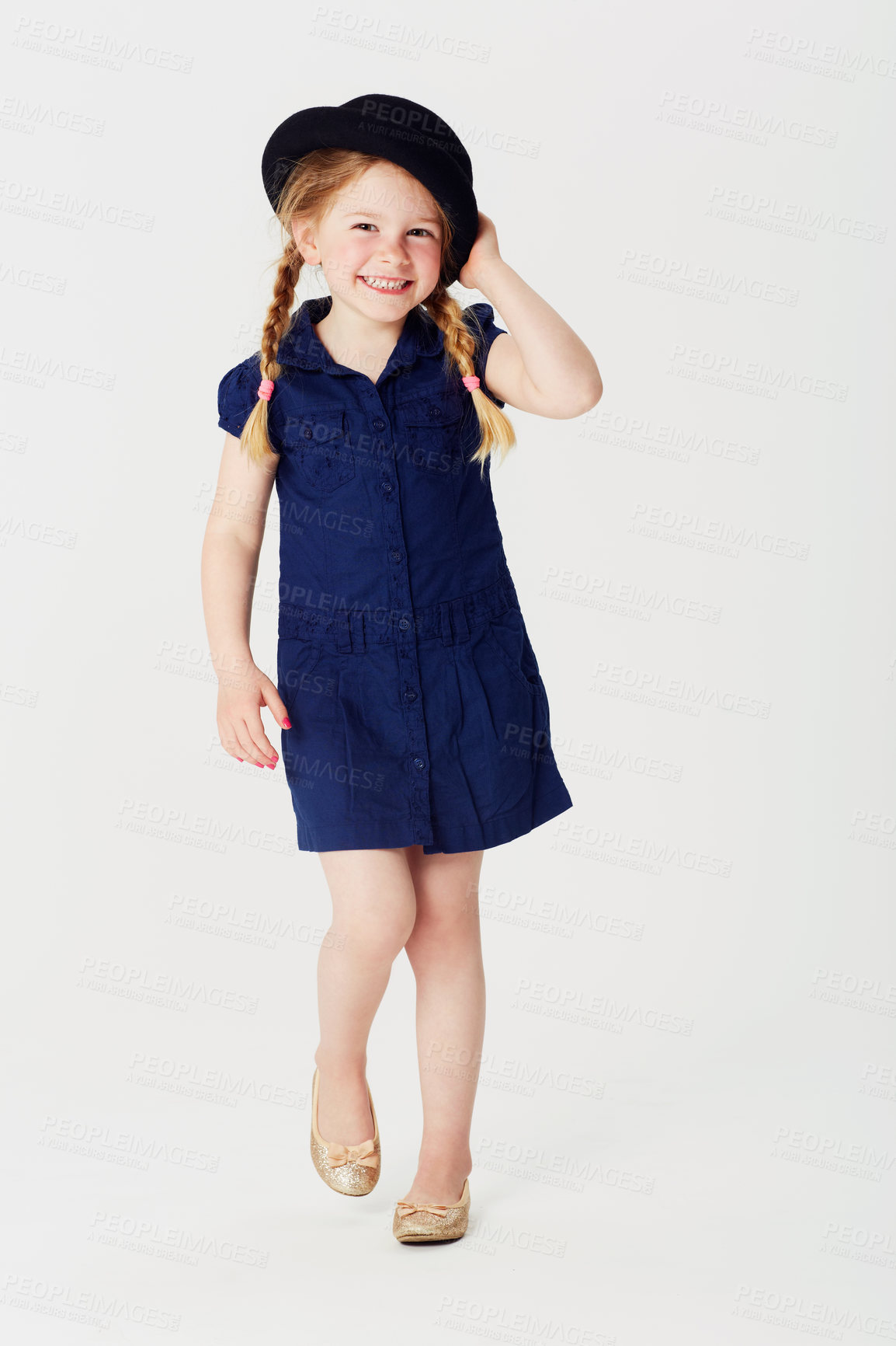 Buy stock photo Portrait, smile and fashion with girl child in studio on white background for casual kids style. Children, dress and hat with happy or confident little youth in cute and adorable blue clothes outfit