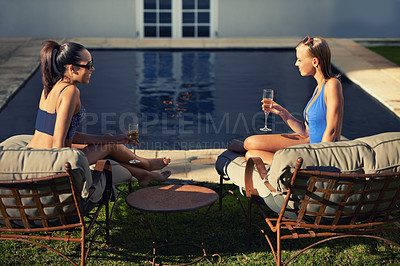 Buy stock photo Women, friends and relax with wine by pool for holiday, vacation or summer adventure with sunglasses and smile. People, swimwear and happy with champagne in backyard or garden of hotel accommodation