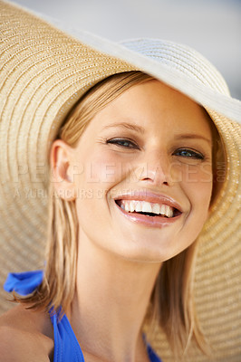 Buy stock photo A young blonde woman wearing a hat and looking at the camera