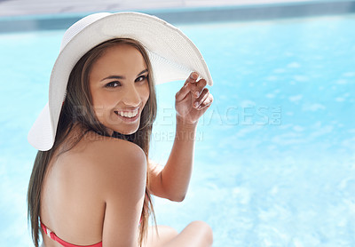 Buy stock photo Happy, portrait and woman at pool with hat, sunshine and and travel for summer holiday at hotel. Relax, water and face of girl on luxury vacation with adventure, weekend or swimming in sun with smile