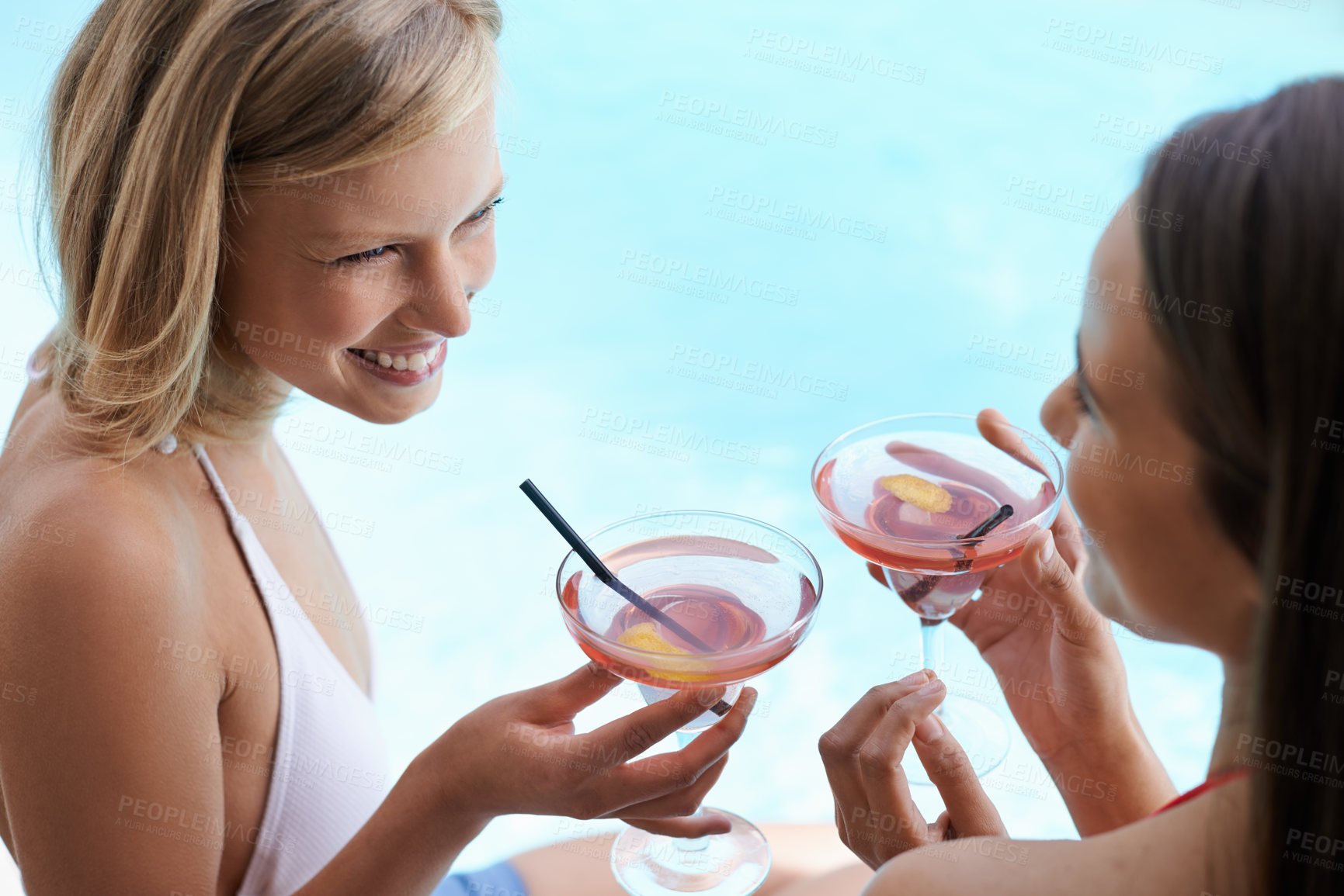 Buy stock photo Friends, relaxing and laughing with alcohol at pool, bonding and drinking cocktail on vacation. People, communication and outdoors for funny conversation on holiday, weekend trip and travel to resort