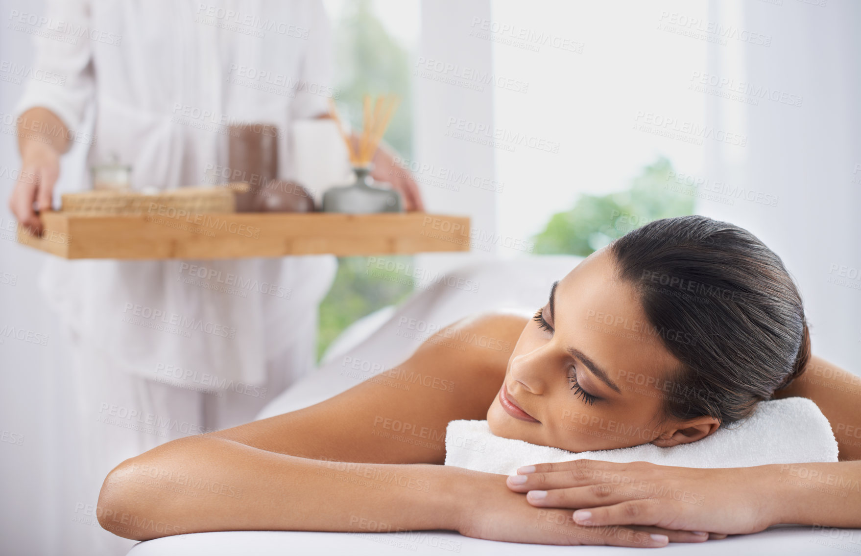 Buy stock photo Peace, massage and woman at spa to relax, beauty and pamper for wellness at luxury salon. Therapist, calm and person in treatment for skincare, wellbeing and resting for healthy body with masseuse