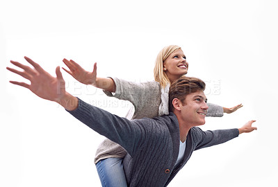 Buy stock photo Couple, piggy back and airplane with arms, smile and funny game with care for connection with bonding outdoor. Man, woman and playful with plane, wings or flight for freedom on journey for vacation
