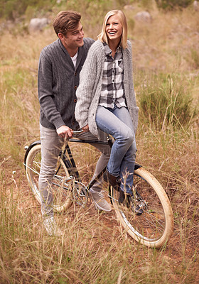 Buy stock photo Couple, happy and field with retro bicycle on holiday, adventure or date with sustainable transport. Man, woman and vintage bike with smile for vacation with journey in nature, path or environment