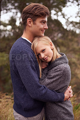 Buy stock photo Couple, portrait and smile with hug outdoor in countryside for holiday, vacation and anniversary getaway in forest. Love, man and woman with face, happy and embrace in woods for relationship and care