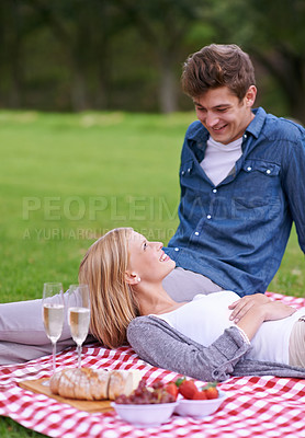 Buy stock photo Couple, champagne and relax on picnic blanket in park with conversation, vacation or memory in nature. Man, woman and outdoor on grass with food, lunch or wine glass with smile on Valentines day date