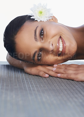 Buy stock photo Flower, relax or portrait of happy woman in spa for wellness, cosmetics or hospitality in hotel. Calm peace, smile or person in resort on break or holiday vacation for beauty, skincare or health
