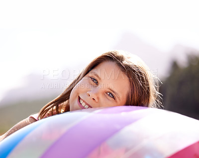 Buy stock photo Portrait, smile and girl child with beach ball outdoor in nature, forest or woods for travel and vacation. Face, summer and relax with happy young kid in natural park for holiday, fun or adventure