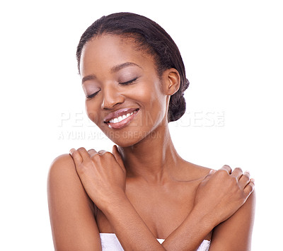 Buy stock photo Studio shot of a beautiful young woman touching her skin